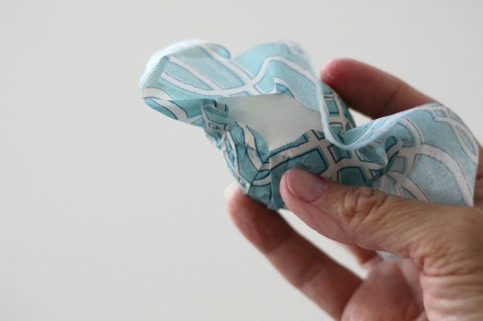 When you get to the back of your napkin wrapped Easter egg, you'll need to trim it a little
