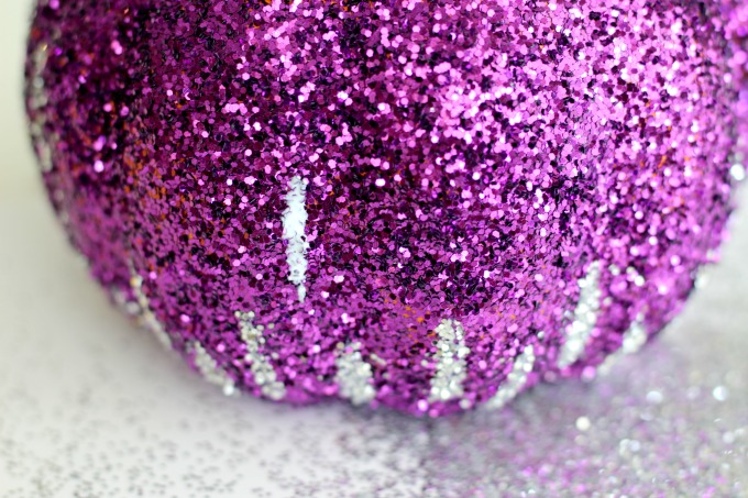 Sprinkle your glitter pumpkin with silver glitter