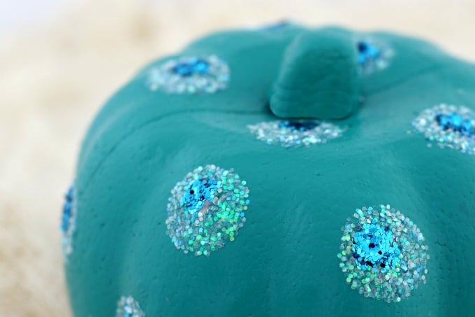 A little white glitter topped with blue gave our teal pumpkin a peacock look
