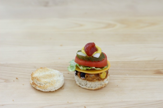 Top the mini veggie burger with ketchup and mustard
