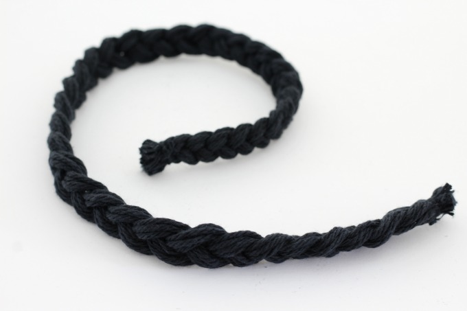 Braid yarn to make a tail for your black cat pumpkin