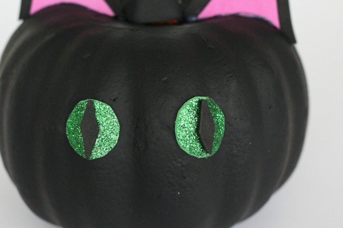 Stick the eyes on your black cat pumpkin
