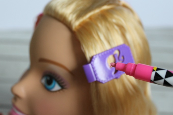 The stencils allow girls to make pretty designs in Barbie's hair