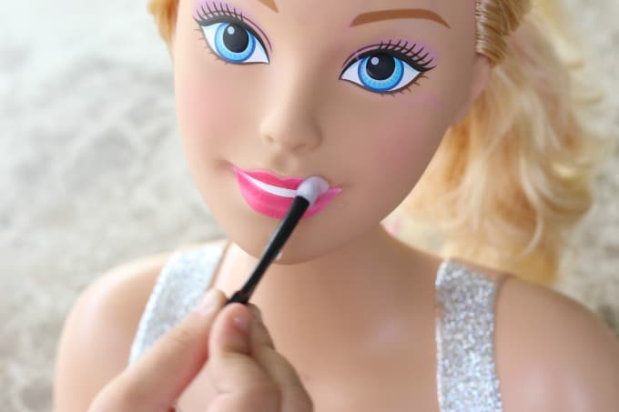 The lipstick on the Barbie styling head changes colors