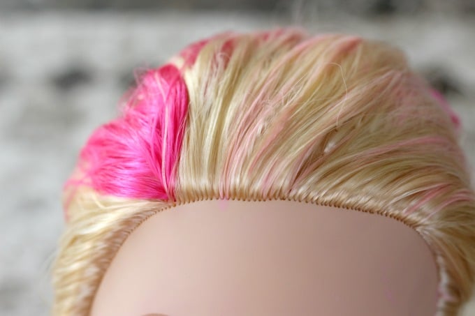 Little girls can play hair stylist with their Barbie toys