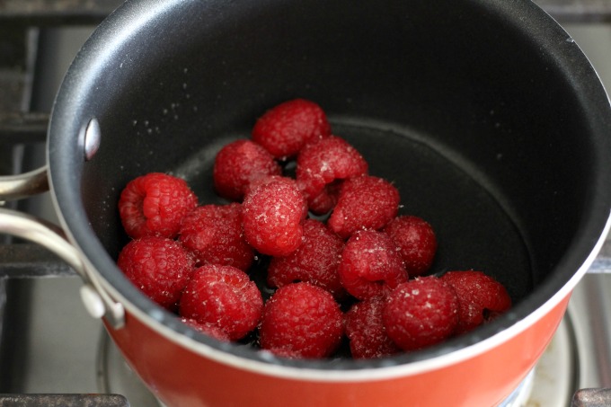 Cook raspberries in a saucepan to make the puree