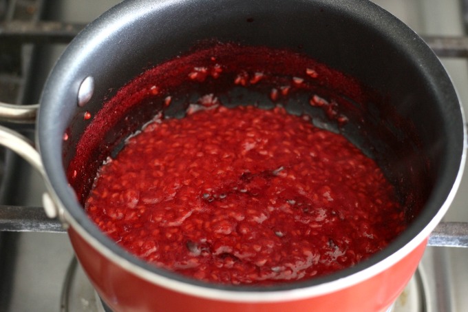 When the raspberries form a syrup like consistency, use a strainer to separate the seeds