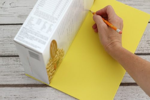 Tracing cereal box onto craft foam