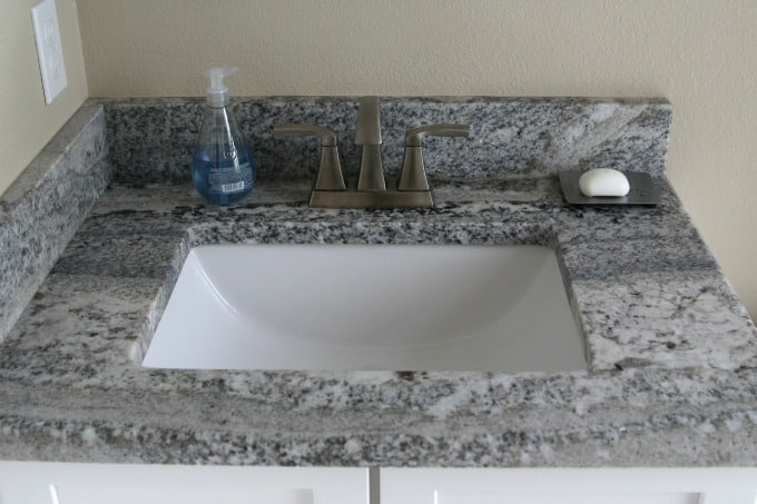 This sink could definitely use a coastal themed bathroom makeover