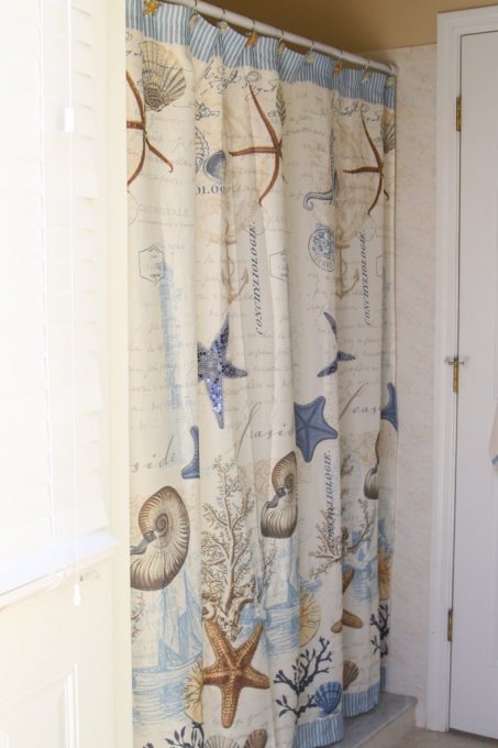 This pretty shower curtain is perfect for a coastal themed bathroom makeover
