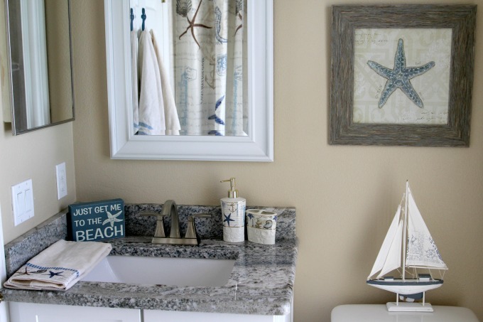 This coastal themed bathroom makeover looked great.