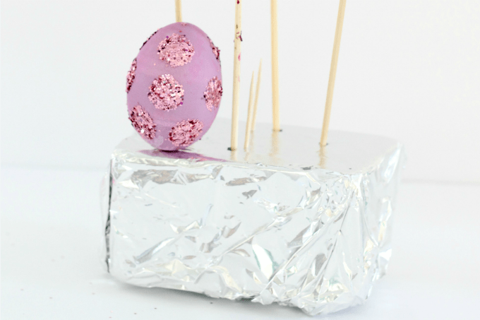 If you just have a few spots that need to try, you can prop up your hollow Easter egg with a toothpick