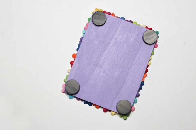 Glue magnets to the back of the picture frame craft