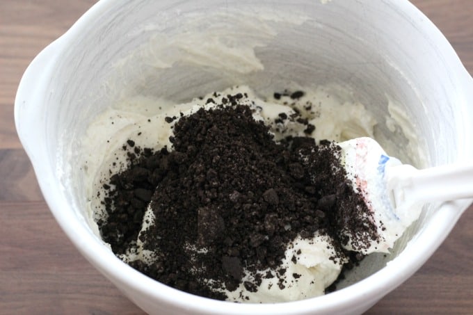 Stir 1/2 cup of cookie crumbles into the cheesecake mix