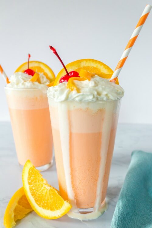 Creamsicle milkshakes with melted whipped cream