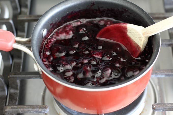 Simmer on medium low heat, then add corn starch to help the blueberry sauce thicken