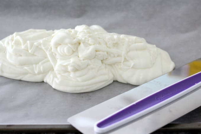 Pour the white chocolate over wax paper