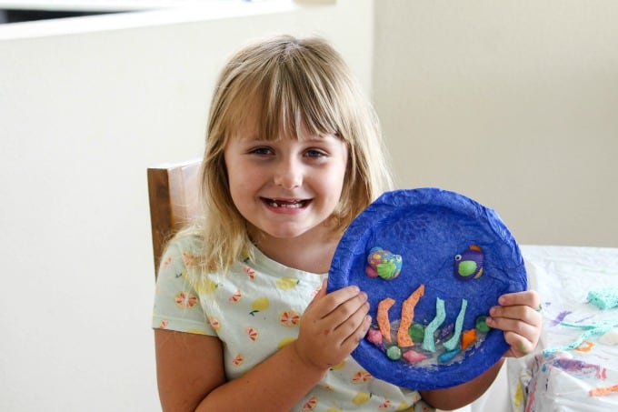 Keira with her paper plate fish craft