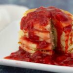 Homemade strawberry syrup on pancakes