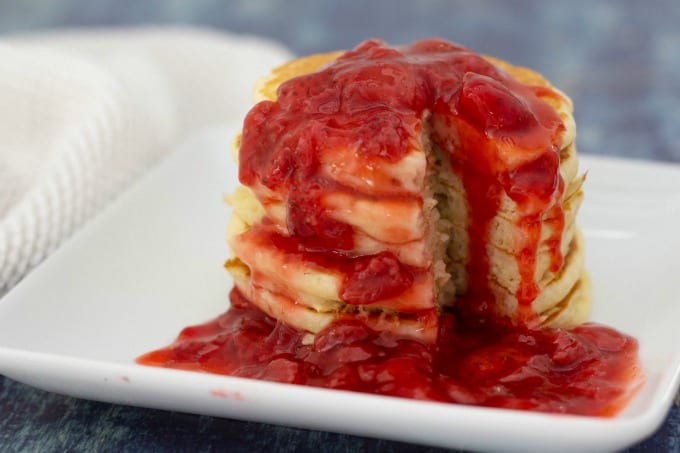 Homemade strawberry syrup on pancakes
