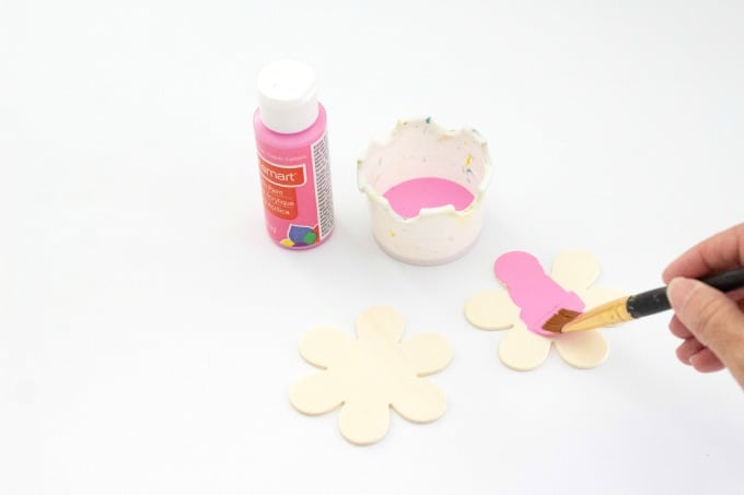 Painting wooden flowers pink for countdown board