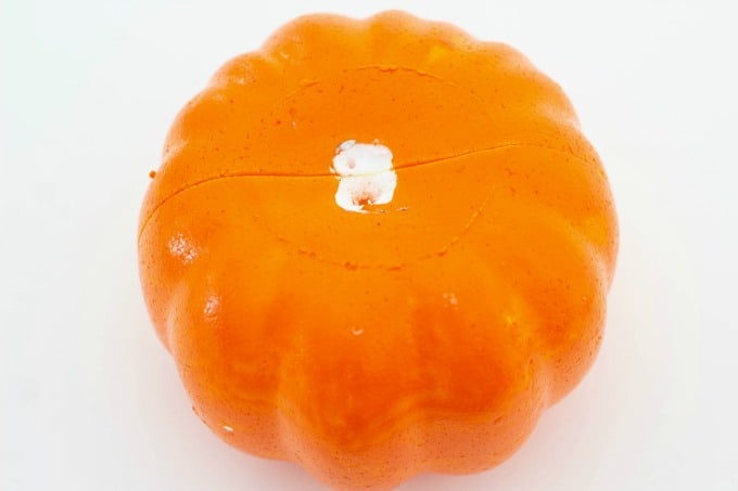 Orange craft pumpkin with stem removed