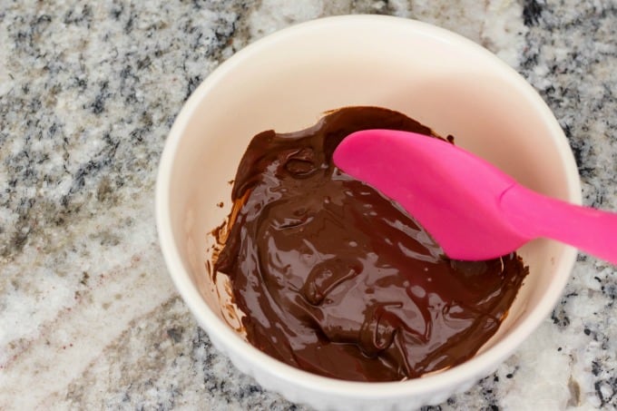 Melted chocolate in bowl for dessert waffles