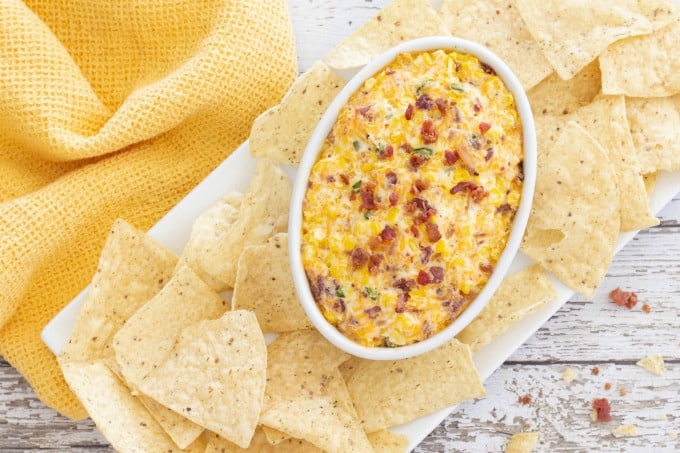 Corn dip on a plate with chips