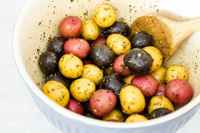 Mixing potatoes with seasoning