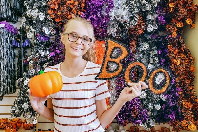 Ashling with pumpkin and boo sign