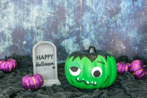 Frankenstein pumpkin with Halloween sign