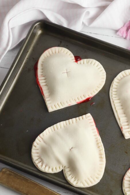 Cherry hand pies on cookie sheet