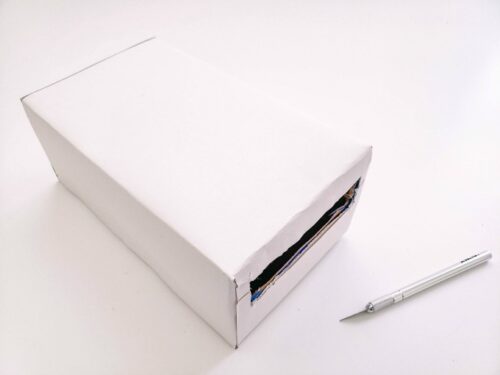 Box covered with white construction paper