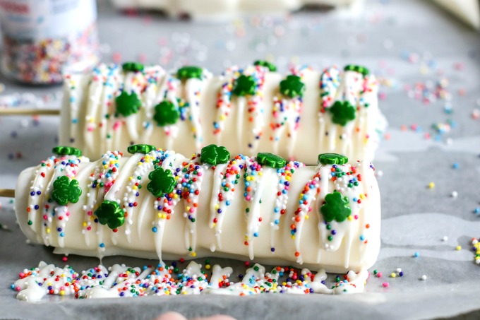 St. Patrick's Day marshmallow pops drizzled with yellow and green chocolate