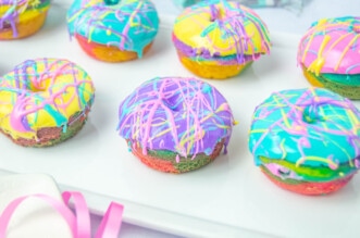 Rainbow donuts on white platter