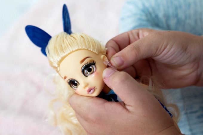 Putting earrings on @PreppyPosh doll