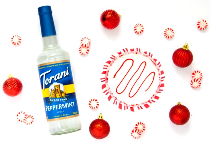 Bottle of Torani Sugar Free Peppermint Syrup with Christmas martini