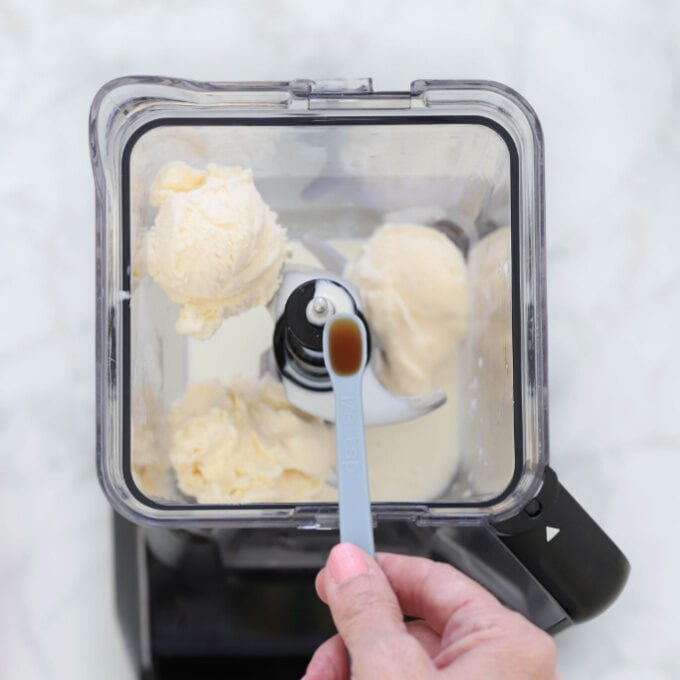 Adding vanilla ice cream to blender
