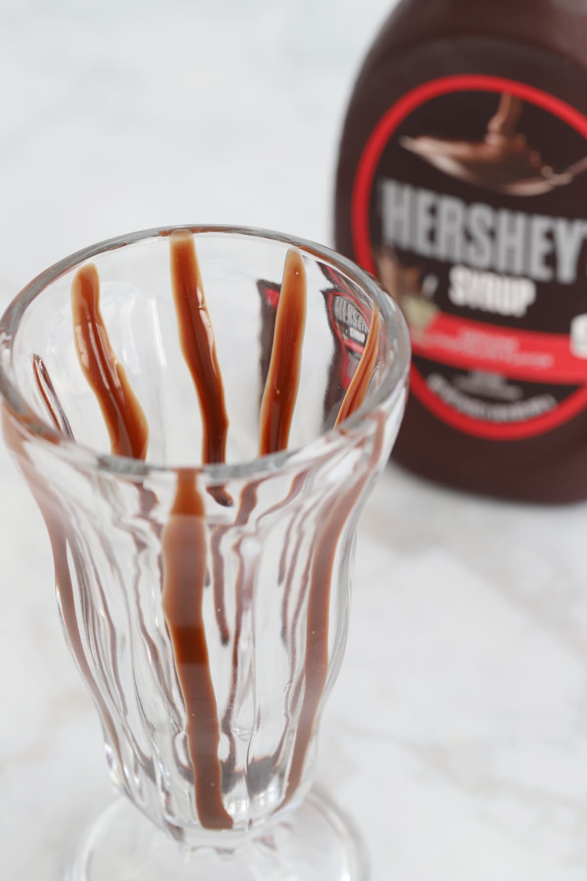 Milkshake lined with chocolate syrup