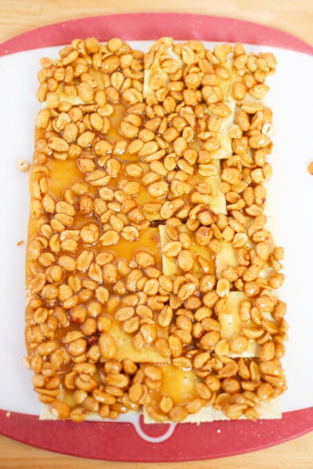 Toffee mixture poured over crackers