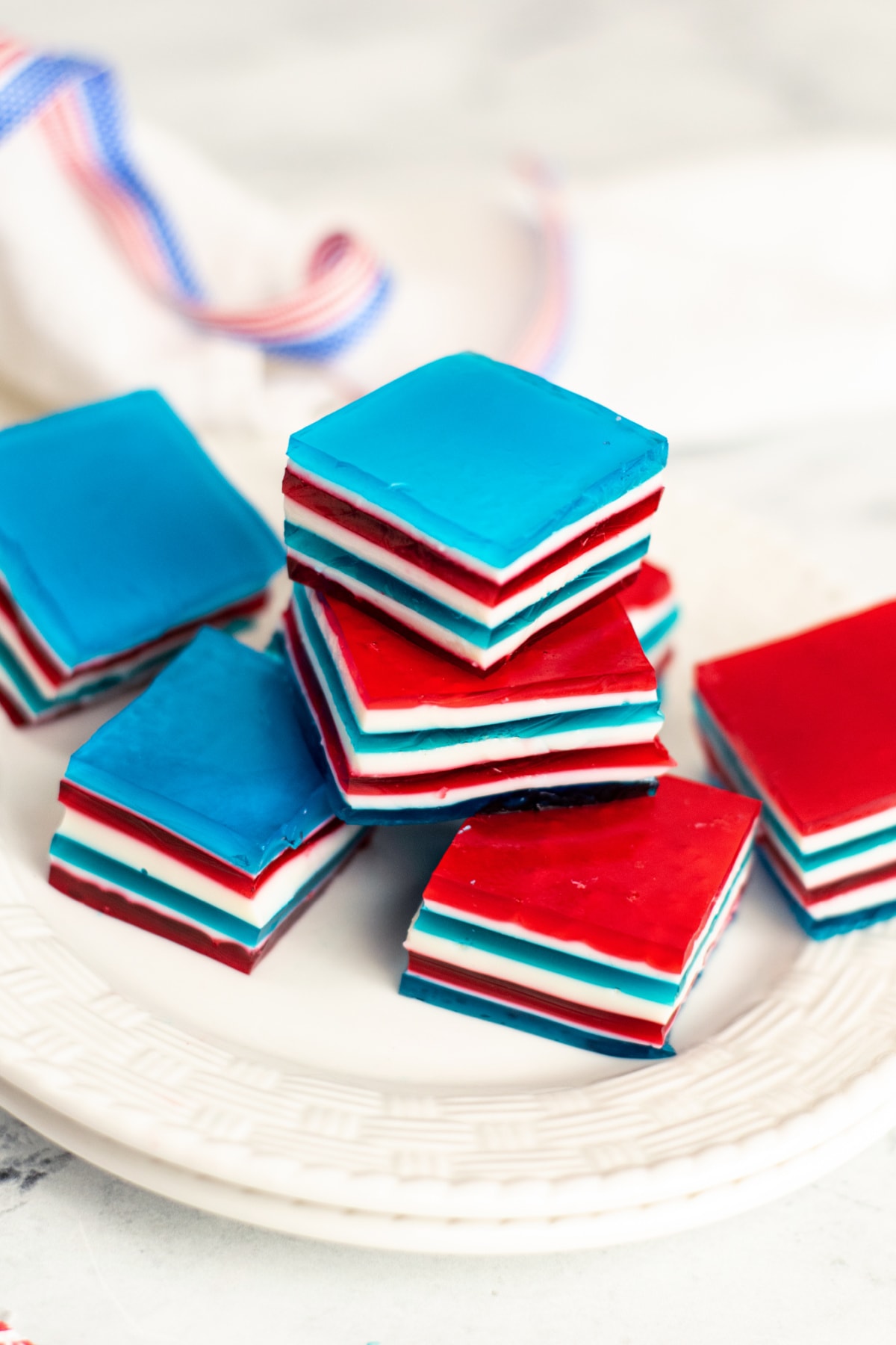 Red, white and blue jello on white plate