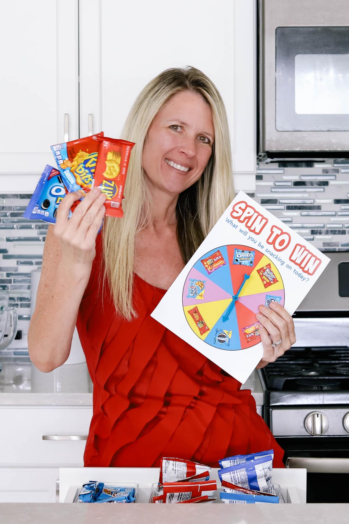 Woman with spinner game and snacks