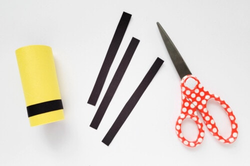Black construction paper stripes for bumblebee craft