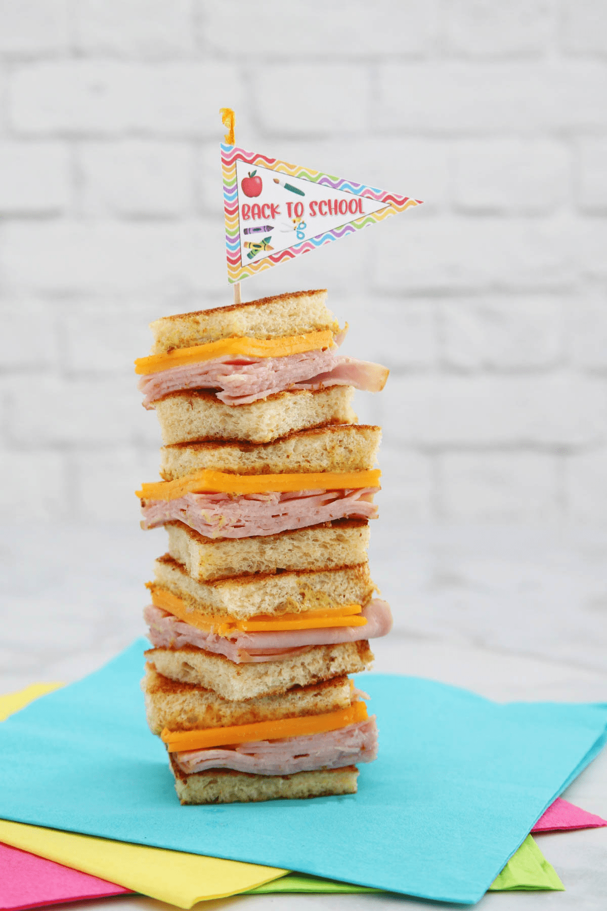 Mini ham and cheese sandwiches stacked