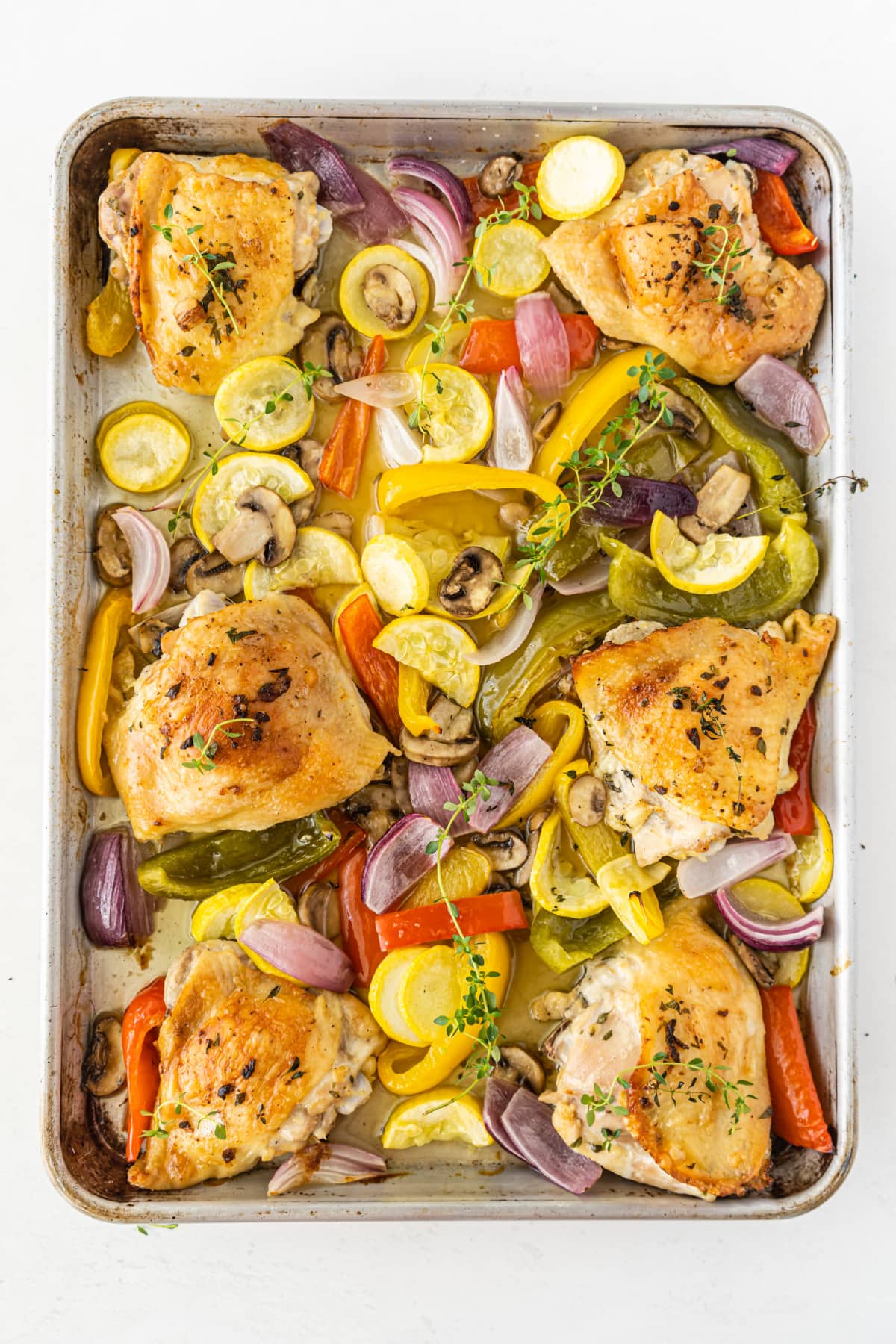 Cooked sheet pan chicken with veggies