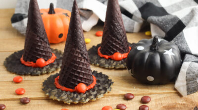 Witch hat cookies with black and white napkin
