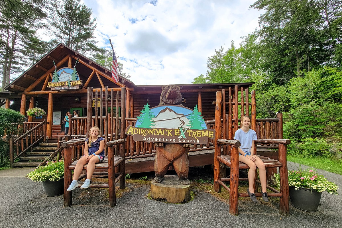 Children sitting in chairs in front of Adirondack Extreme