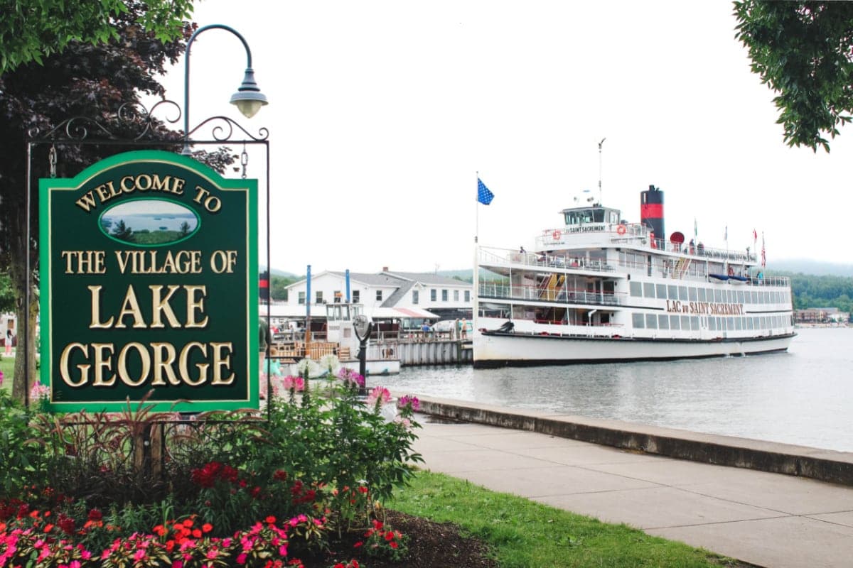 Lake George Village Sign with boat in background