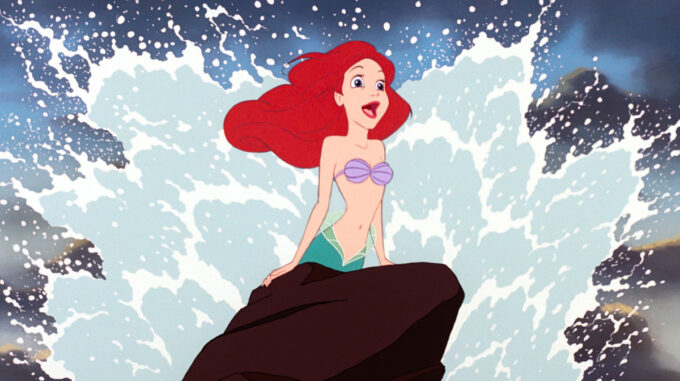 The Little Mermaid singing on a rock
