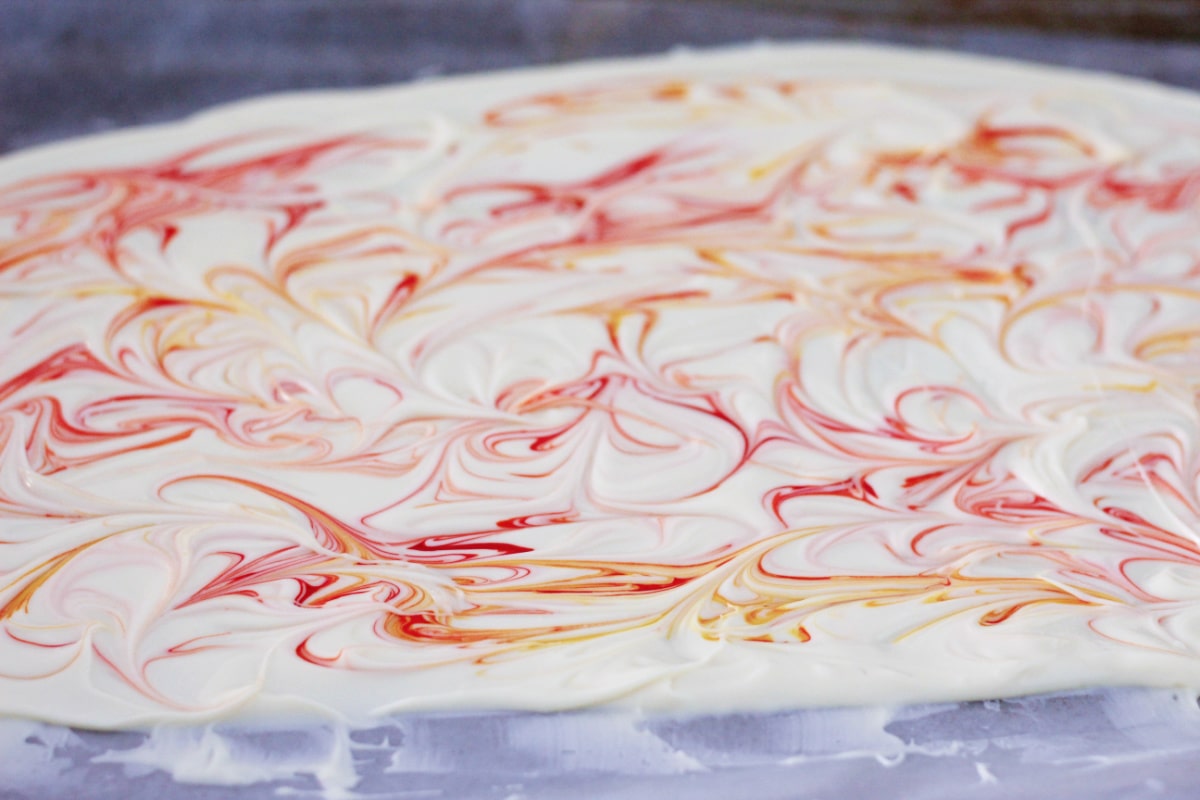 Food coloring swirled into white chocolate